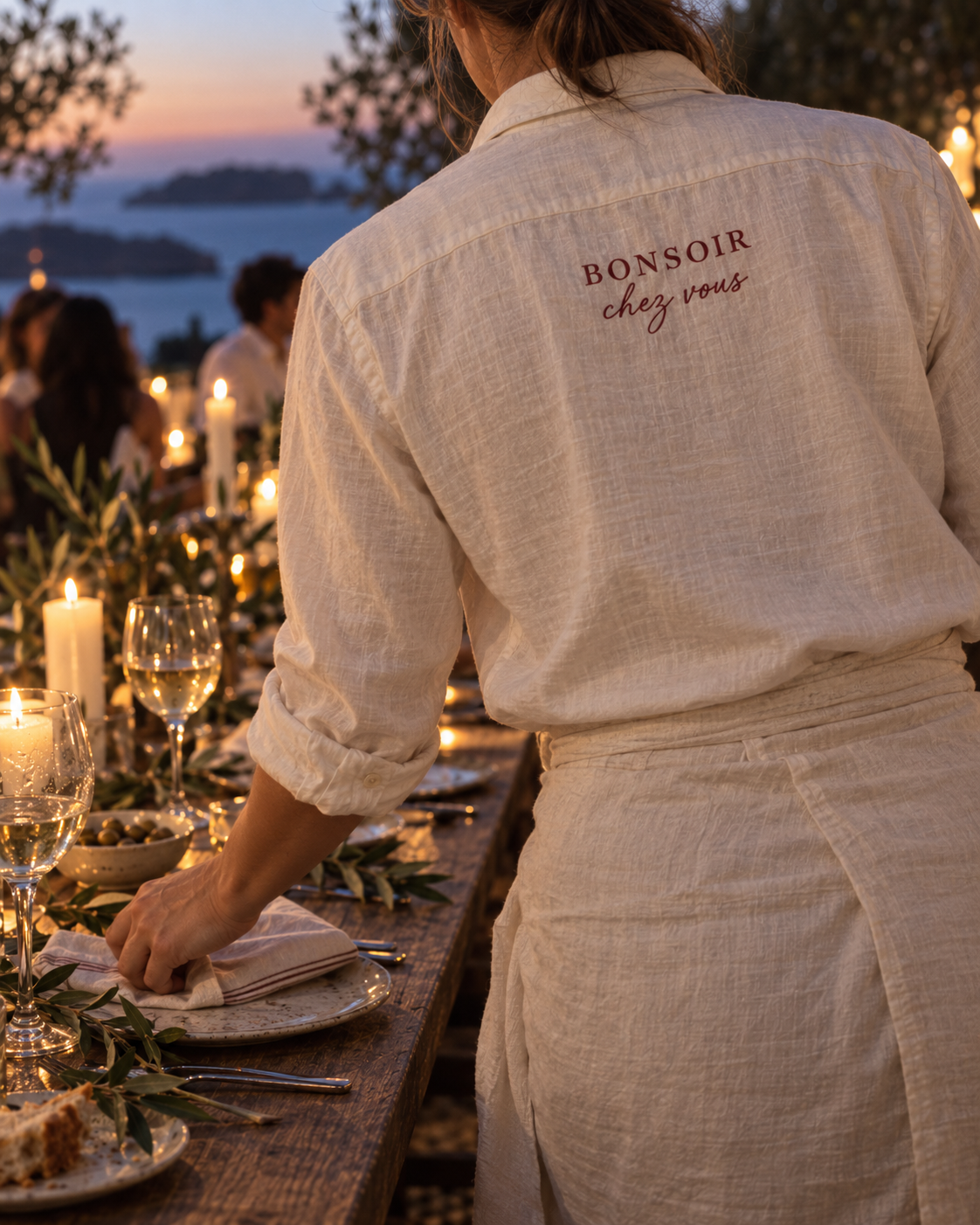 BONSOIR service setting a candlelit dinner table in Ibiza